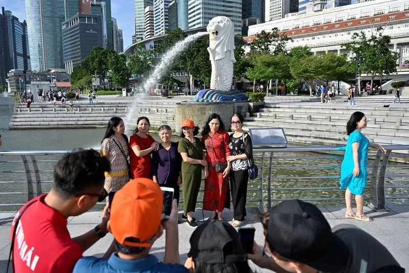 After opening borders, China presses Singapore for visa-free travel deal