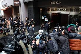 Japan prosecutors raid ruling party offices over kickback scandal