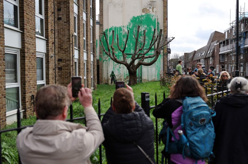 Banksy’s newest mural draws crowds to Finsbury Park, London